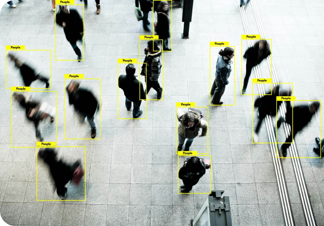 image of people standing and walking on the road