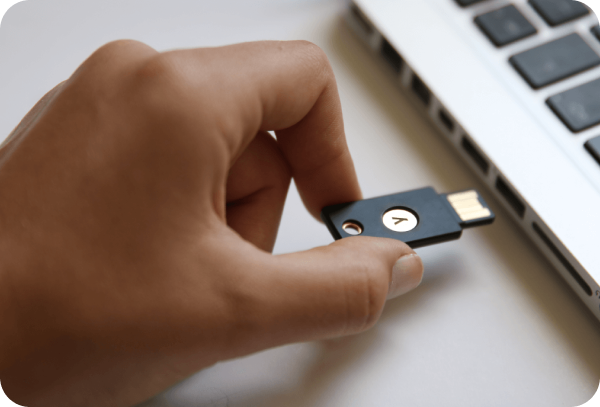 image of hand plugging hardware token